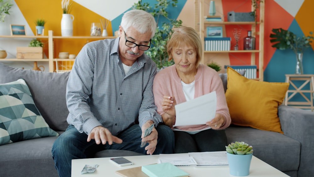 Couple reviewing paperwork and finances together at home